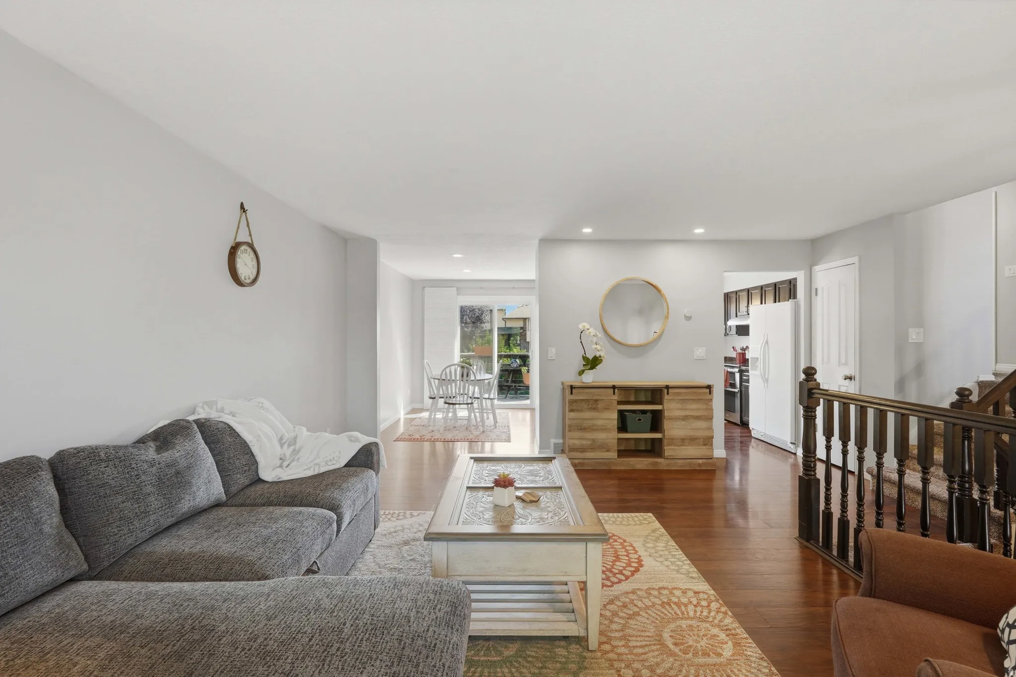 Open-concept living space with wood-finish flooring throughout
