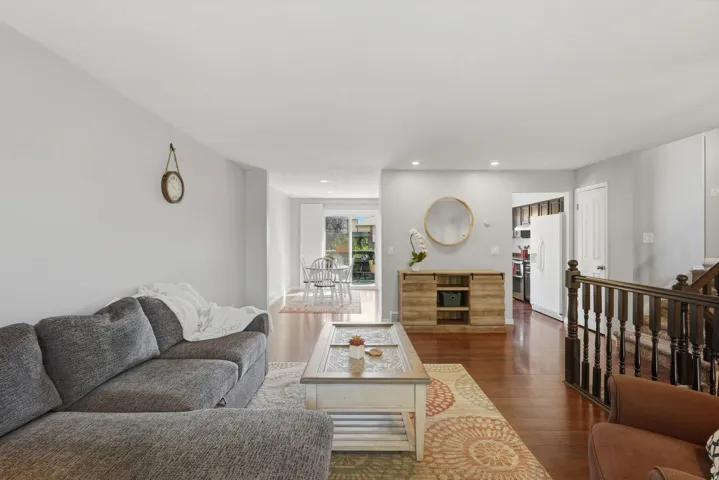 Open-concept living space with wood-finish flooring throughout