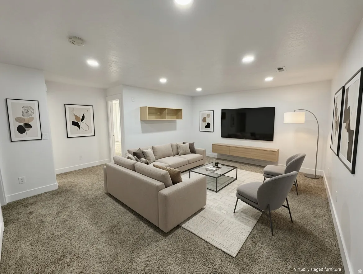 Recessed lighting illuminates this carpeted room featuring a floating wood-finish media console and coordinating open shelving