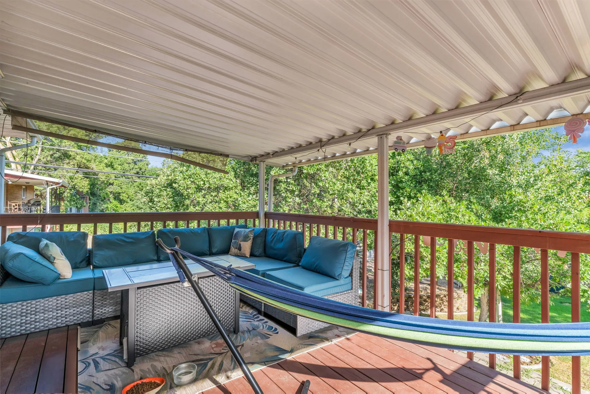 Covered deck featuring wood flooring and a perimeter railing