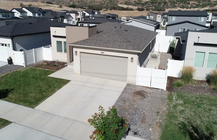 Contemporary stucco and siding exterior with an attached garage