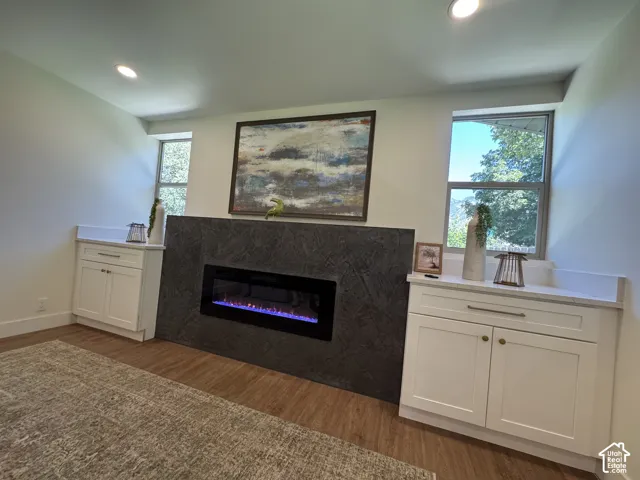 Built-in electric fireplace with stone-finish surround