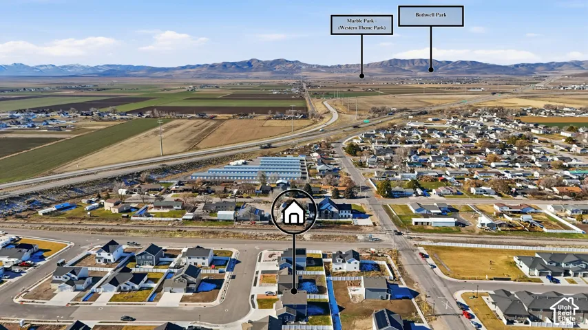 Aerial perspective showcasing residential developments with mountain ranges in the distance