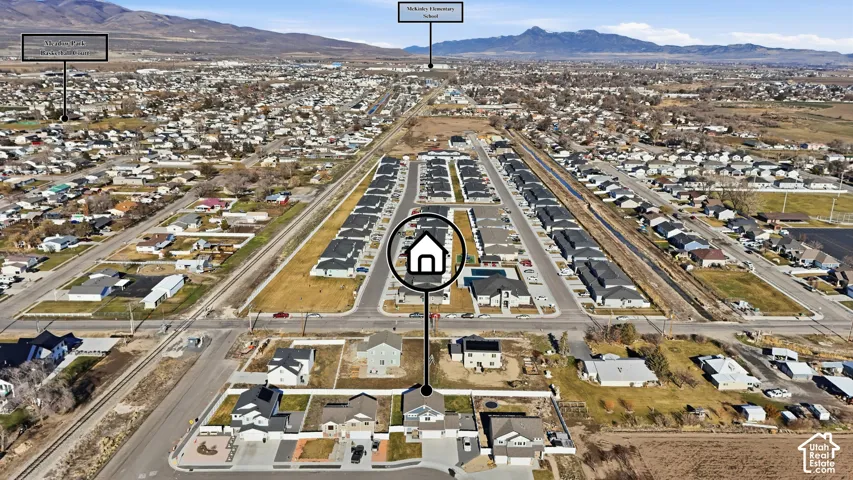 Aerial perspective showcasing a residential development with mountain backdrops