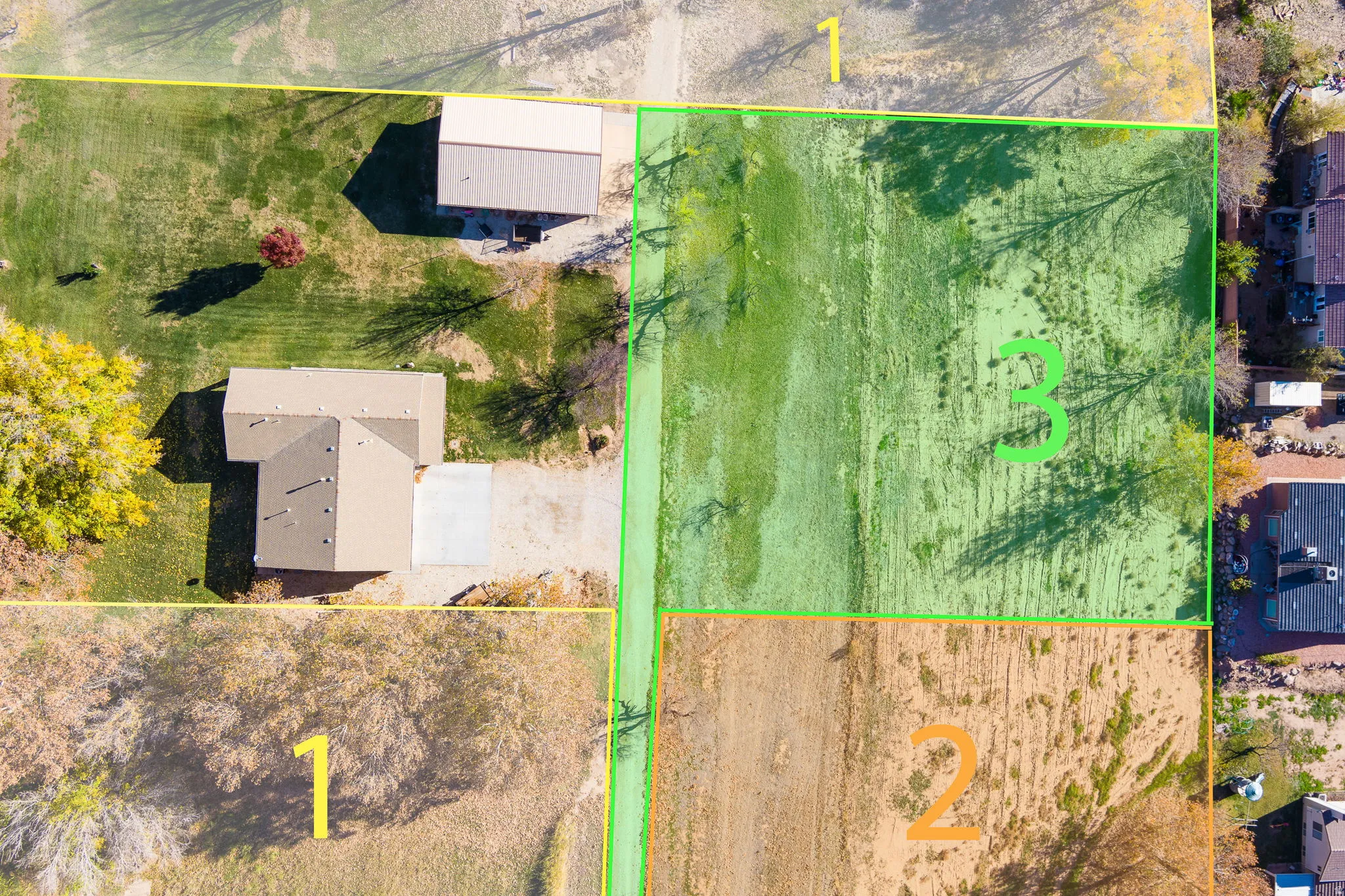 Aerial view showcasing multiple parcels with varied terrain and established structures