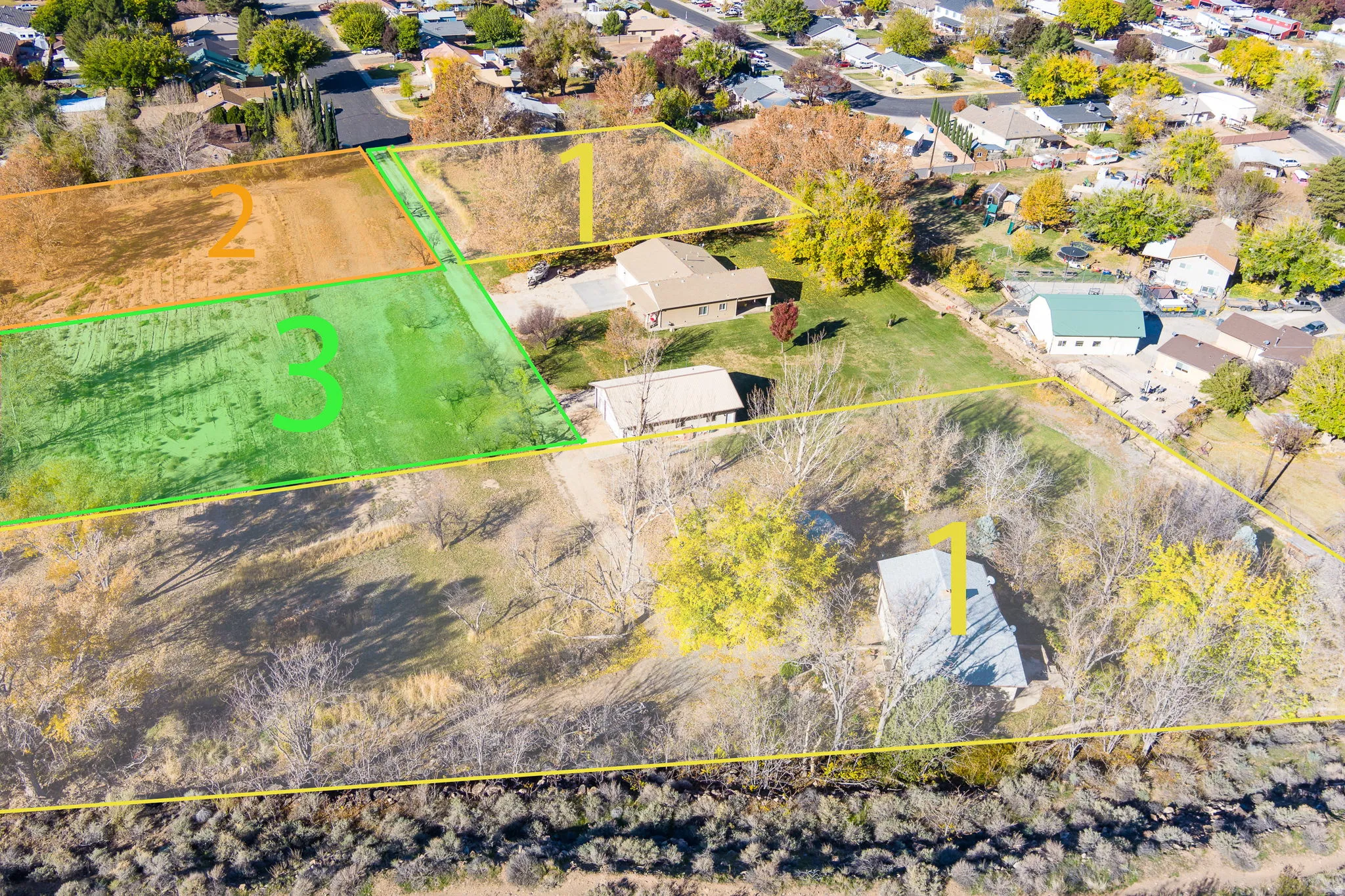 Expansive aerial view showcasing multiple distinct parcels of land