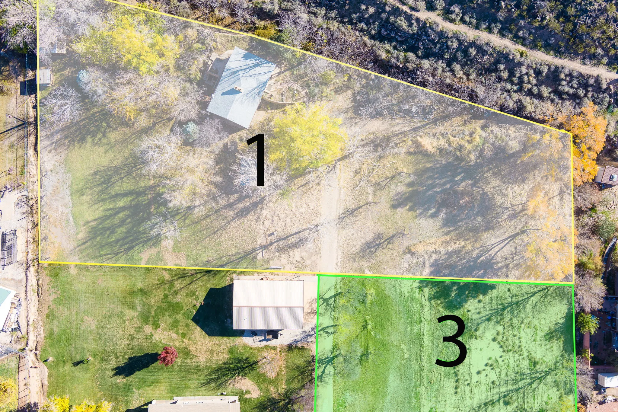 Aerial view showcasing three distinct parcels of land