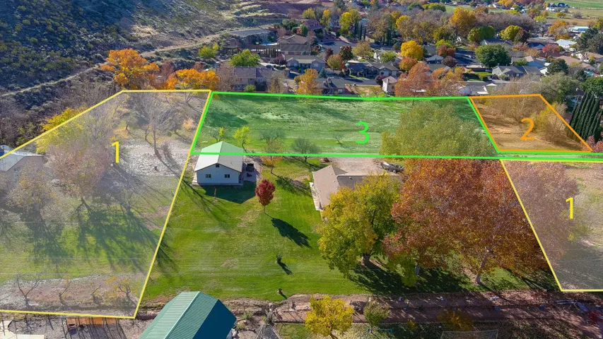 Expansive land parcels outlined in yellow and green, featuring mature trees and a gently sloping terrain