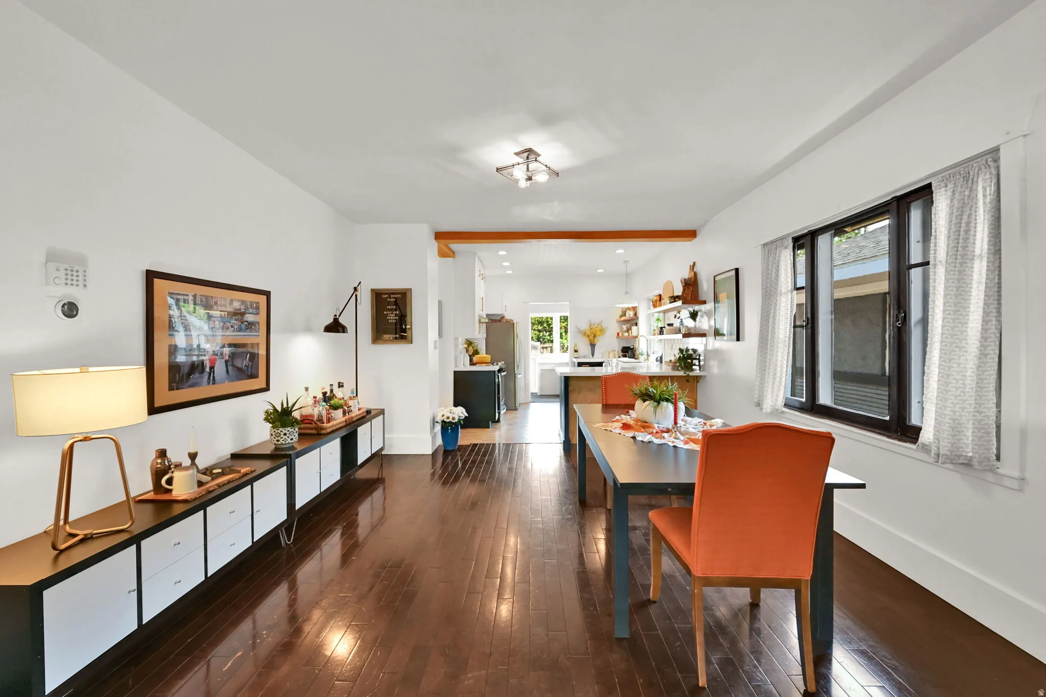 Open-concept living space featuring rich wood flooring