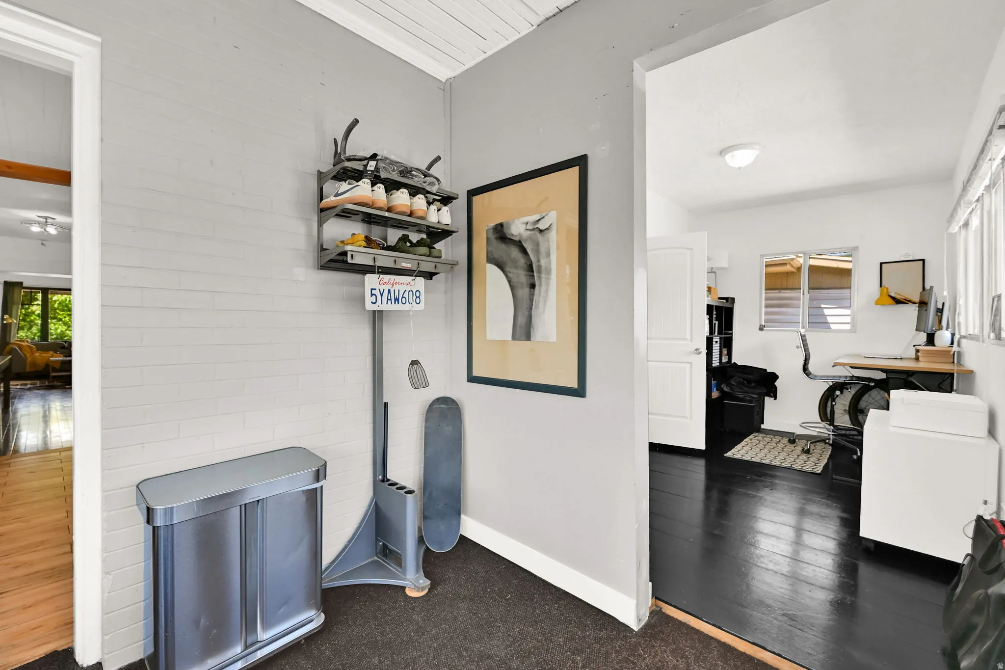 Enclosed porch with white painted brick accent wall