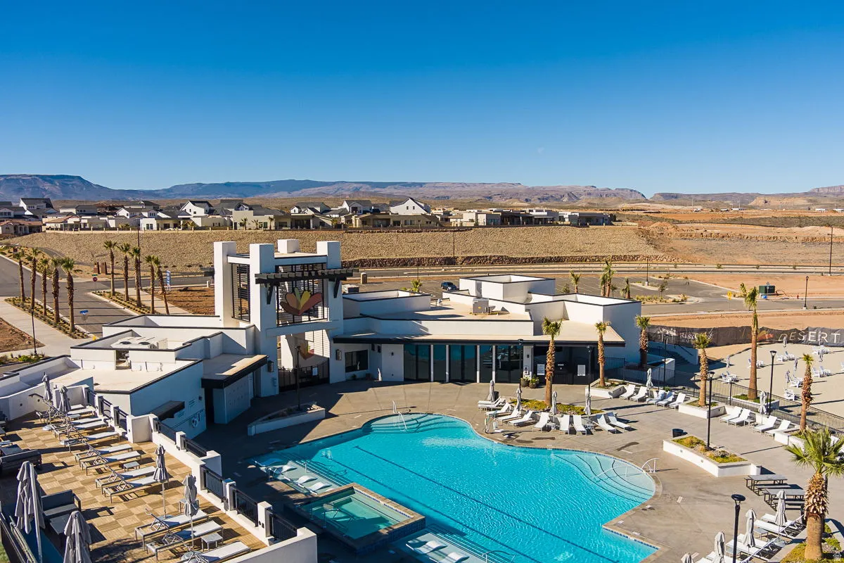 Resort-style community pool with integrated spa and extensive poolside lounging areas