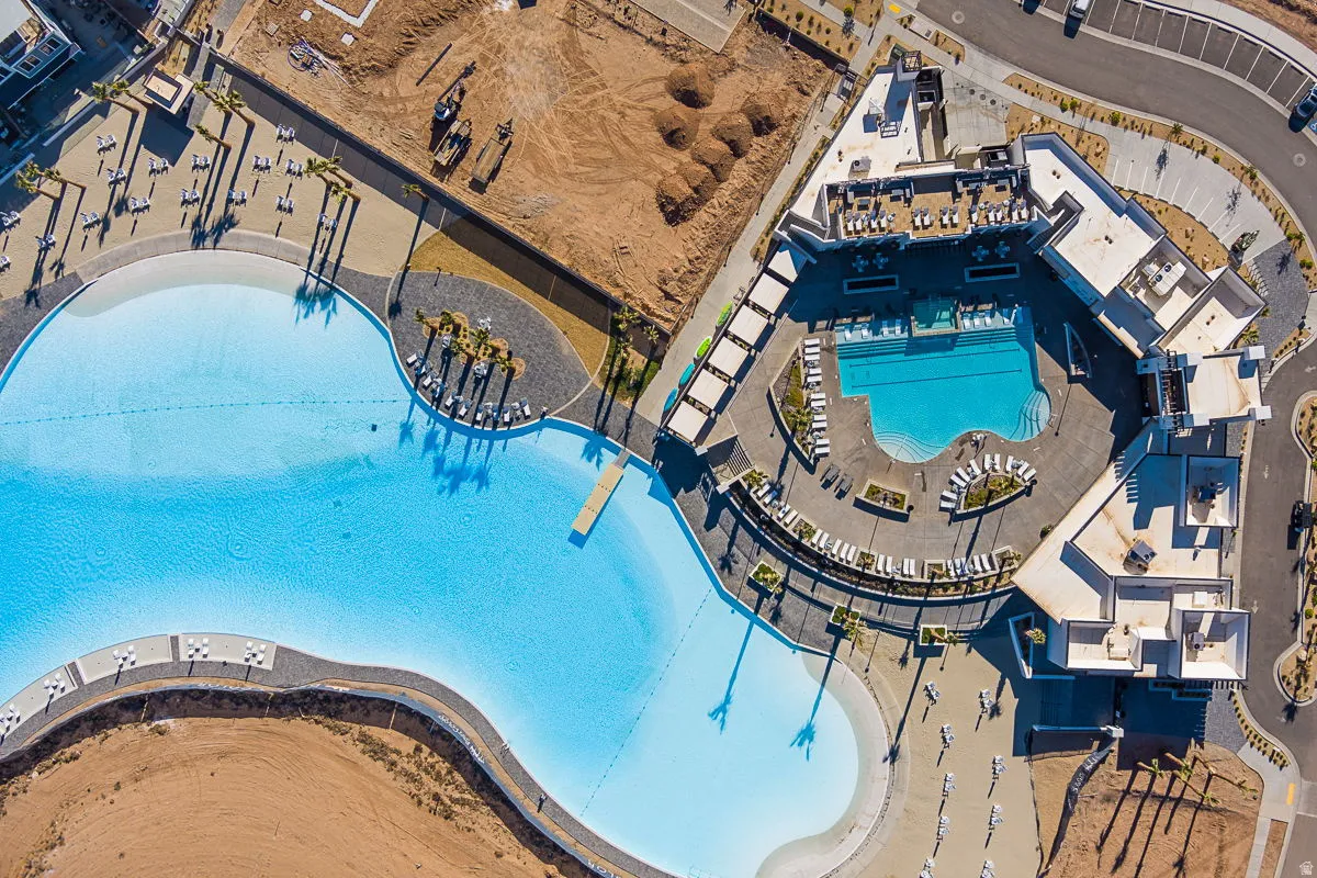 Expansive lagoon-style swimming area with an adjacent resort-style pool complex
