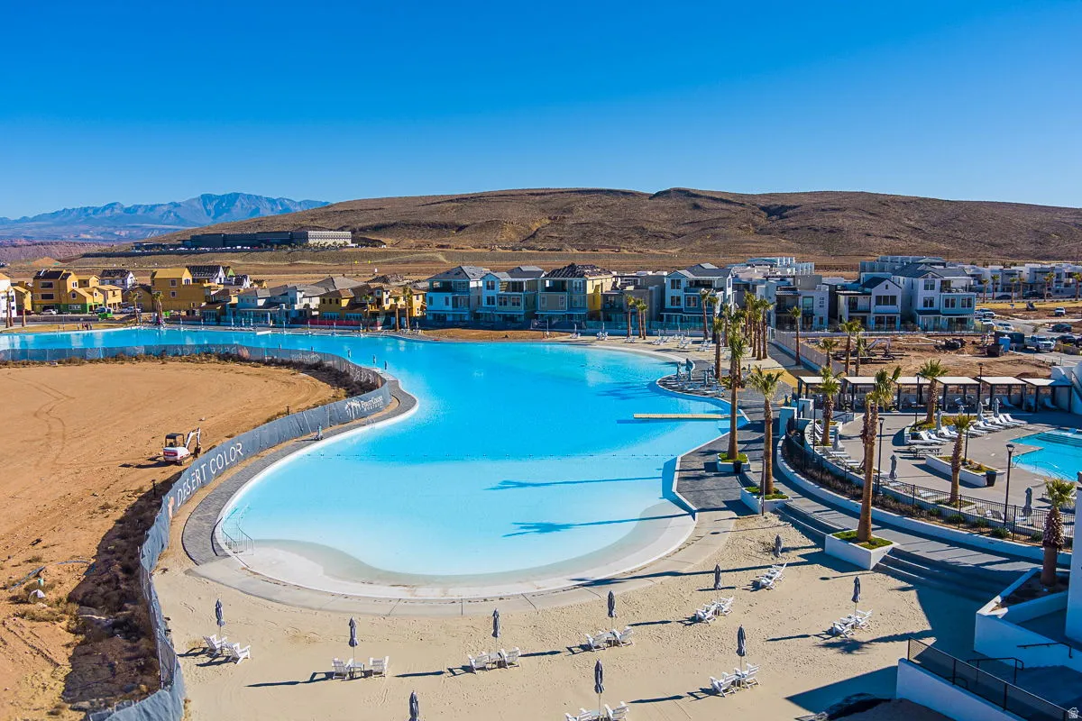 Expansive lagoon with a sandy beach area and surrounding residential structures