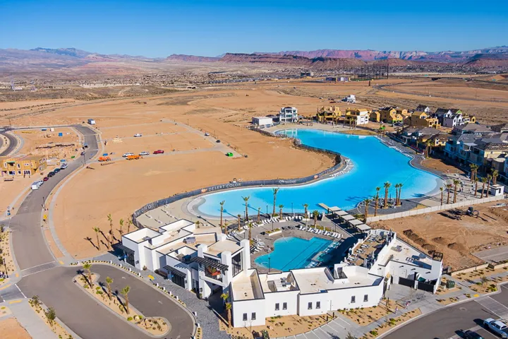 Expansive artificial lagoon with a surrounding paved promenade