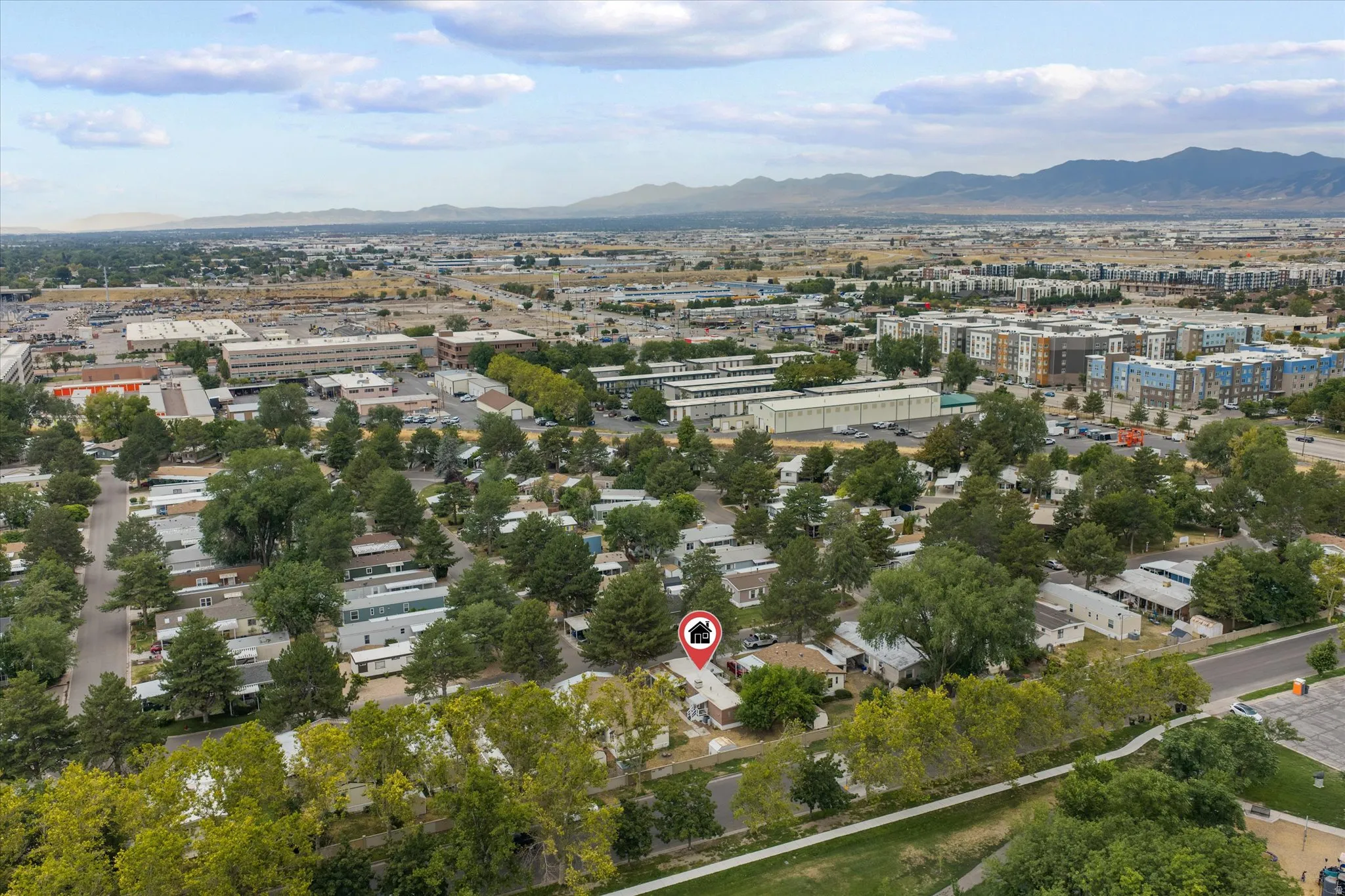 Aerial perspective of a developed urban landscape, featuring a mix of residential and commercial structures