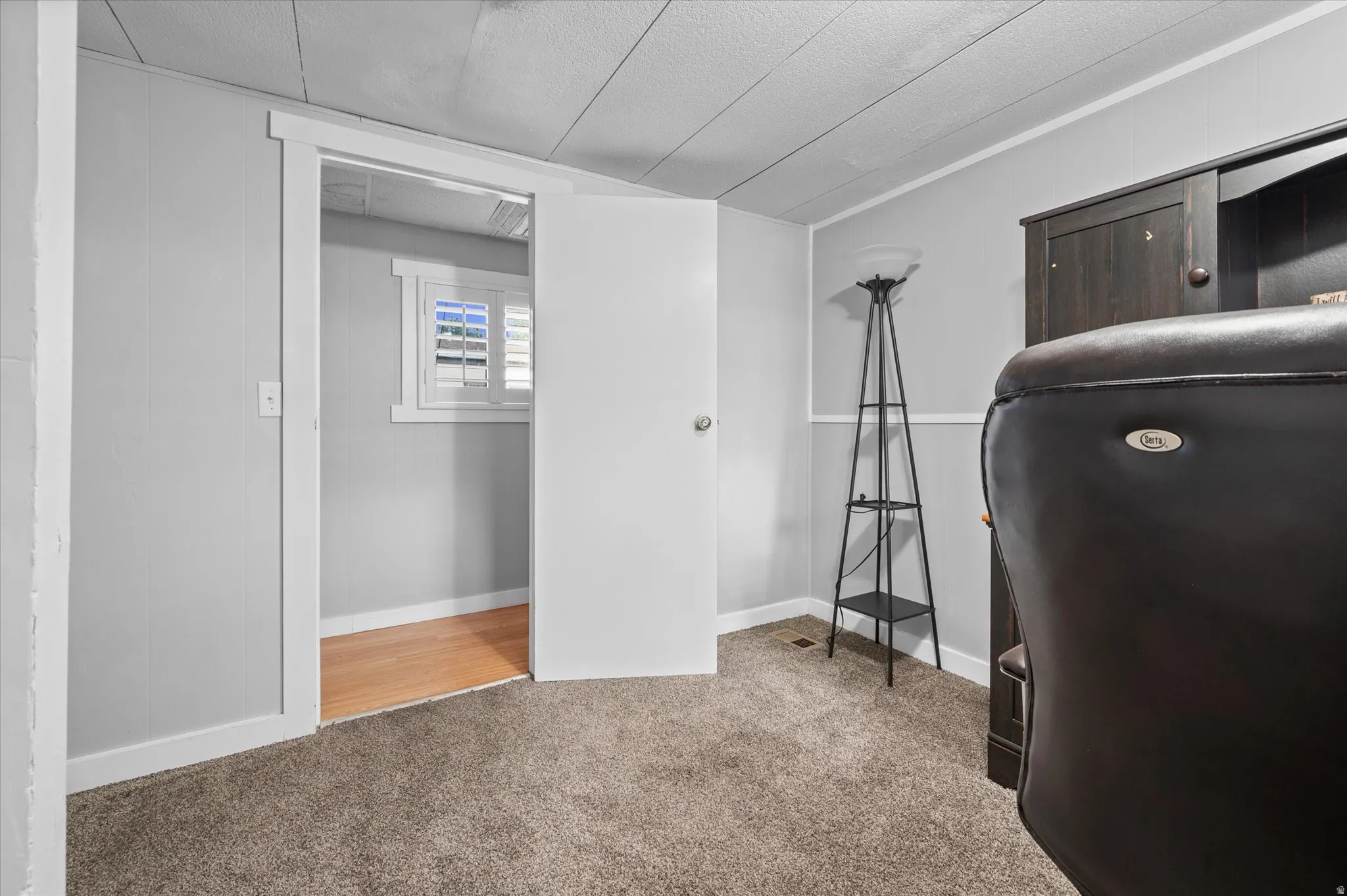 Soft gray walls with white wainscoting and trim