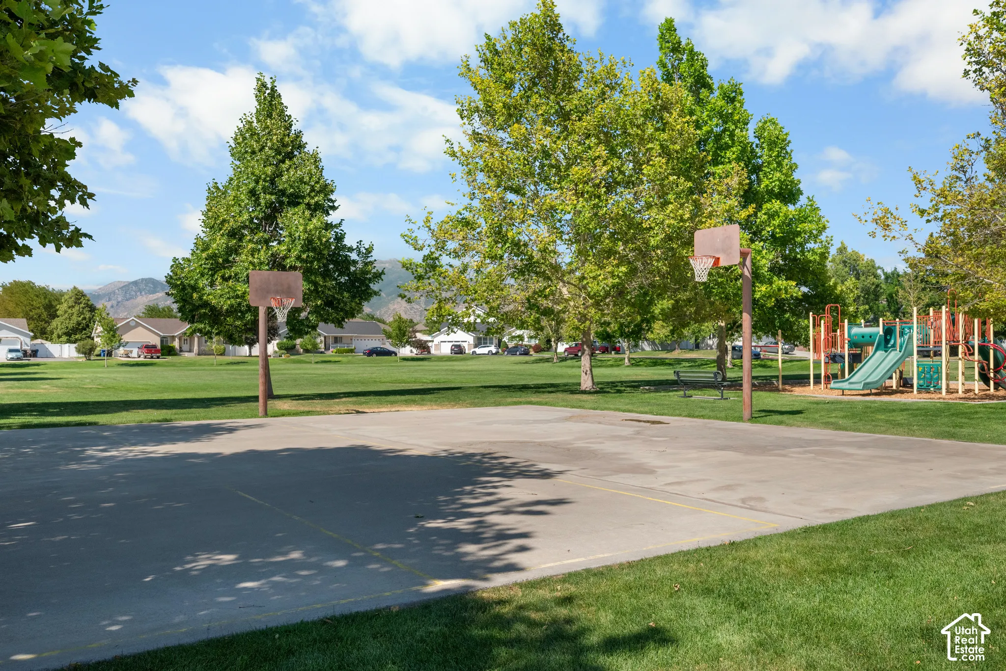 Concrete basketball court with dual hoops