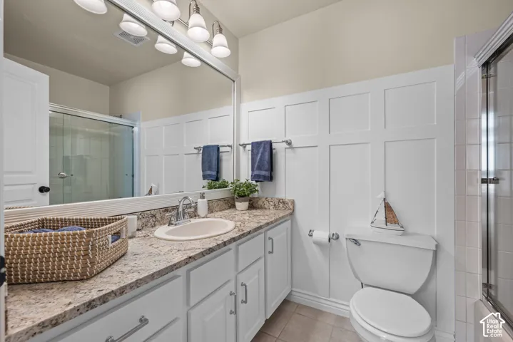 Hall Bathroom featuring a white vanity with granite countertop