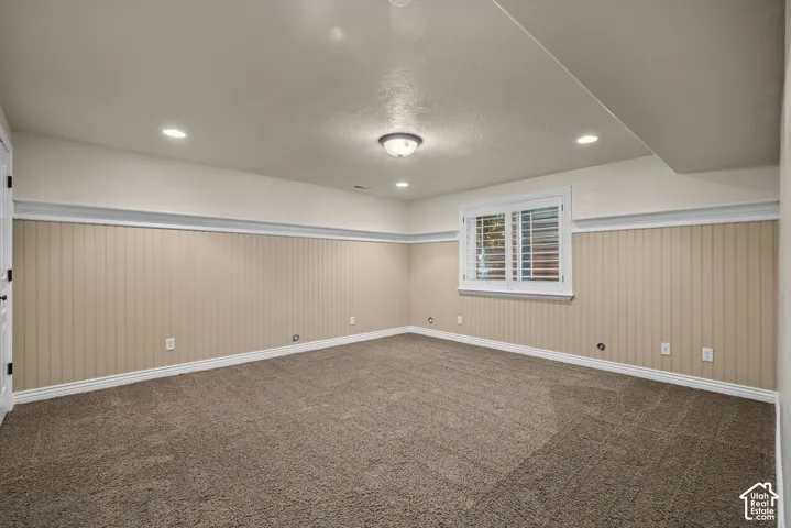 Basement bedroom 4 with wainscoting  wall treatment and recessed lighting