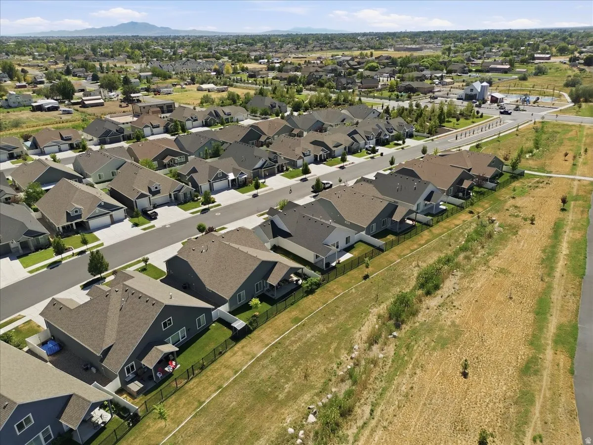 Aerial perspective showcasing a residential community with varied rooflines and a cohesive architectural style
