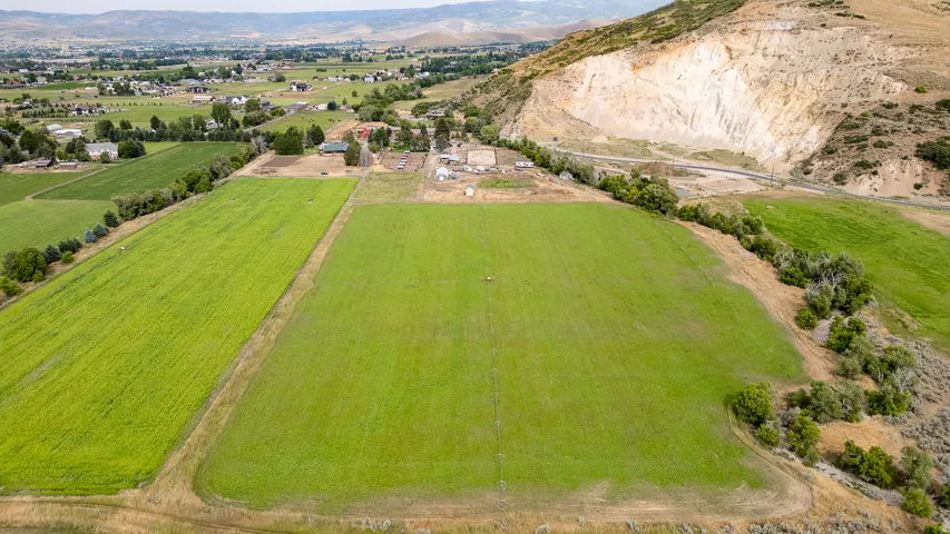 Expansive green fields with cultivated land