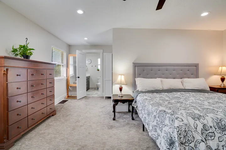 Bedroom featuring light gray carpeting, recessed lighting, ceiling fan, and a window with horizontal blinds