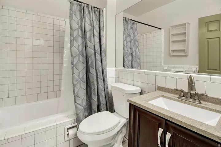 Full Bathroom with white countertops