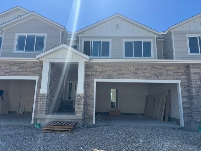 Stone veneer facade with siding accents