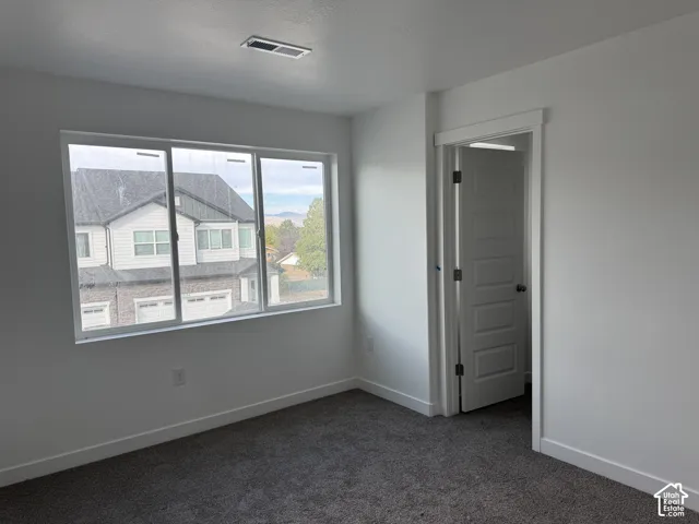 Soft gray carpet flooring complemented by white walls and trim