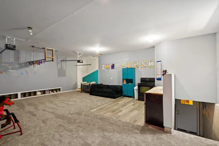 Garage that has been converted into a daycare, easily can be turned back inot a garage by removing the wall.