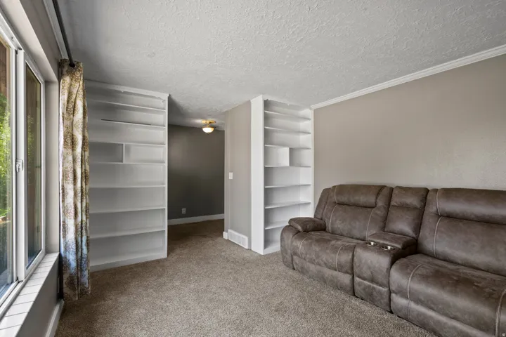 Built-in shelving, large window providing ample natural light