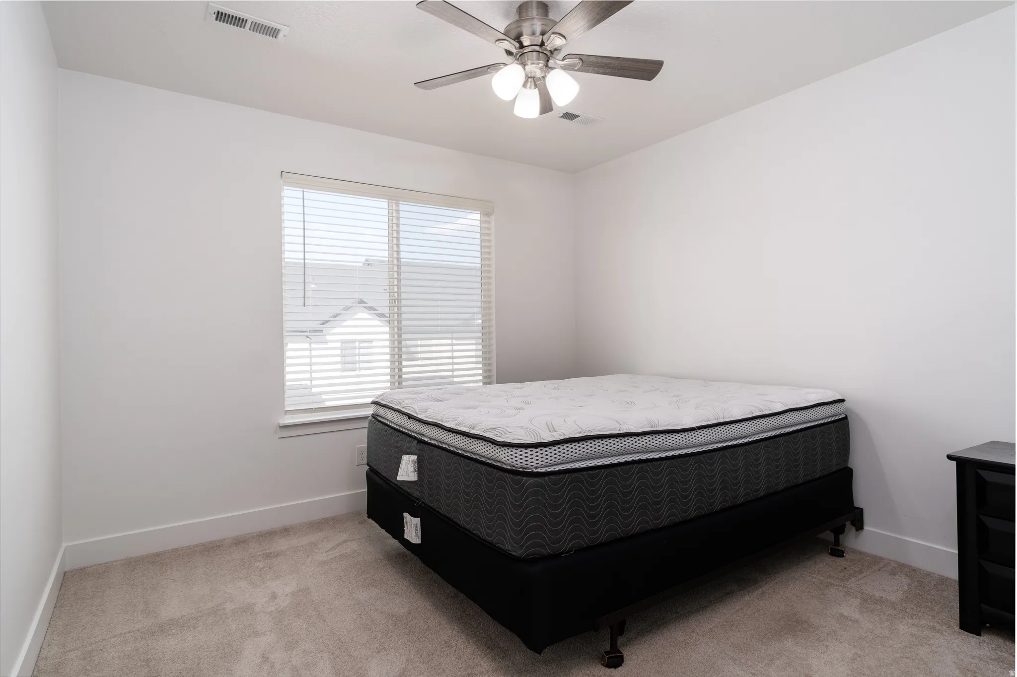 Neutral-toned wall paint and carpeting throughout