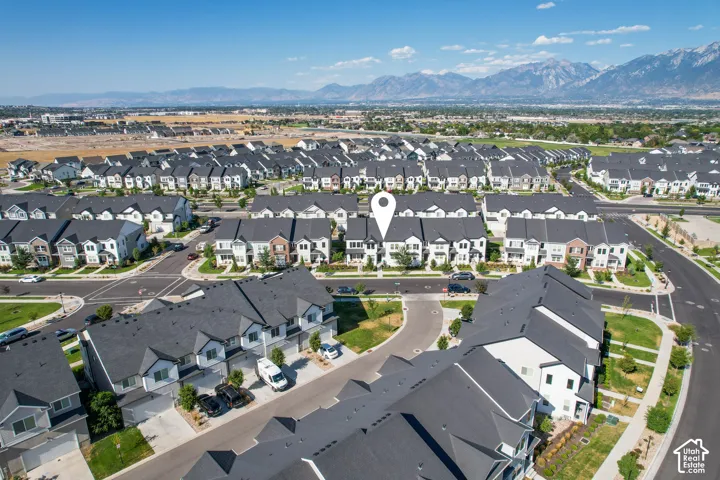 Aerial perspective featuring a community of contemporary townhomes and single-family residences
