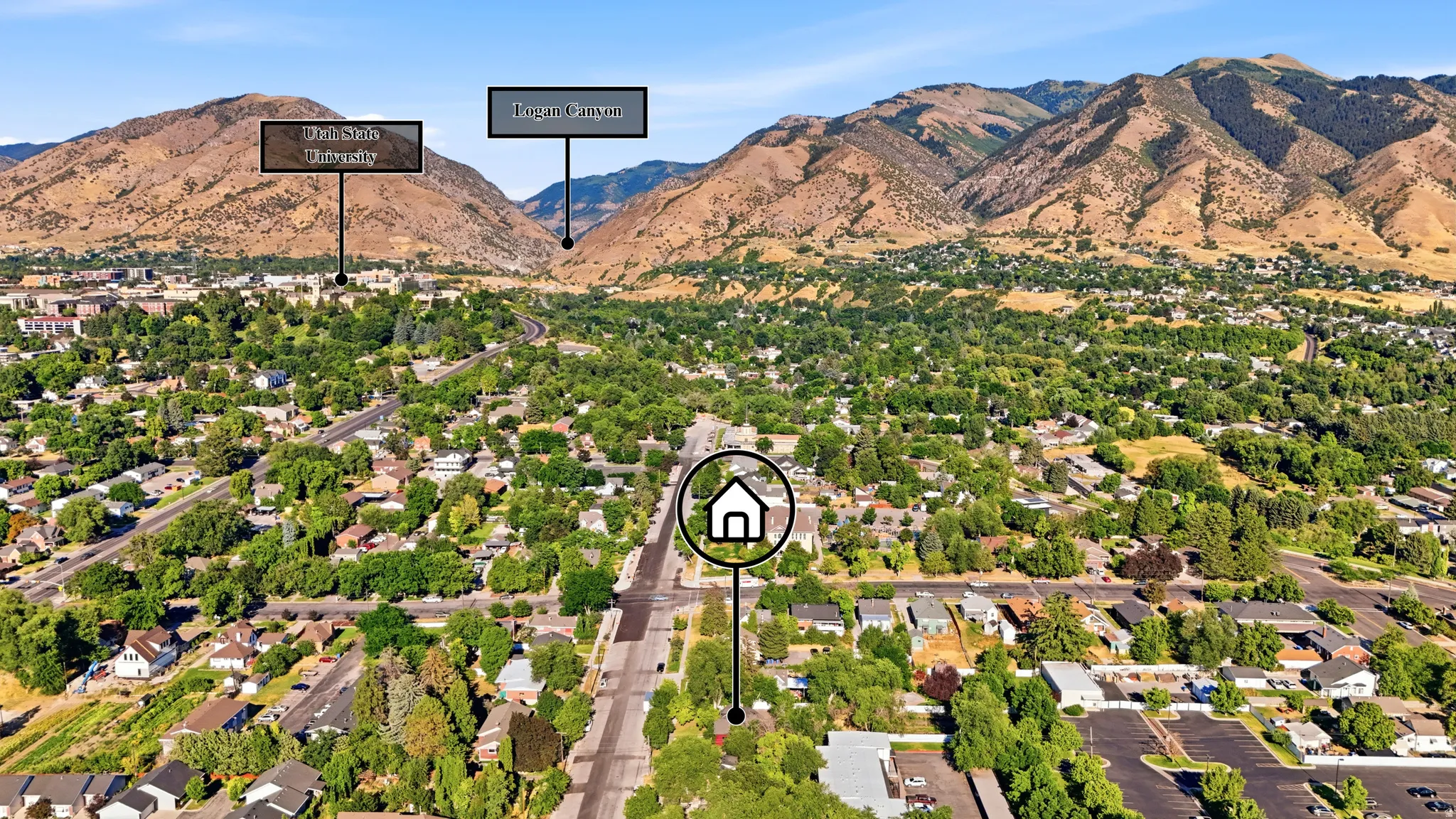 Aerial perspective showcasing a residential area set against a mountainous backdrop