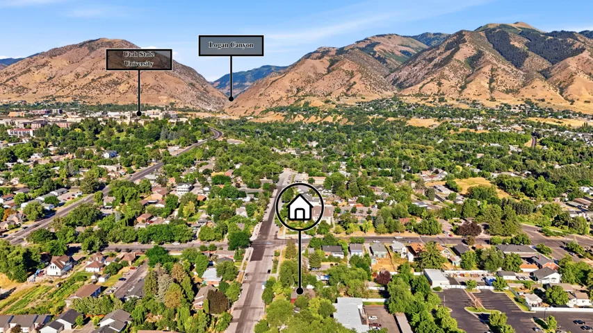 Aerial perspective showcasing a residential area set against a mountainous backdrop