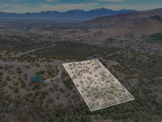 Expansive land parcel featuring natural shrubbery and varied terrain