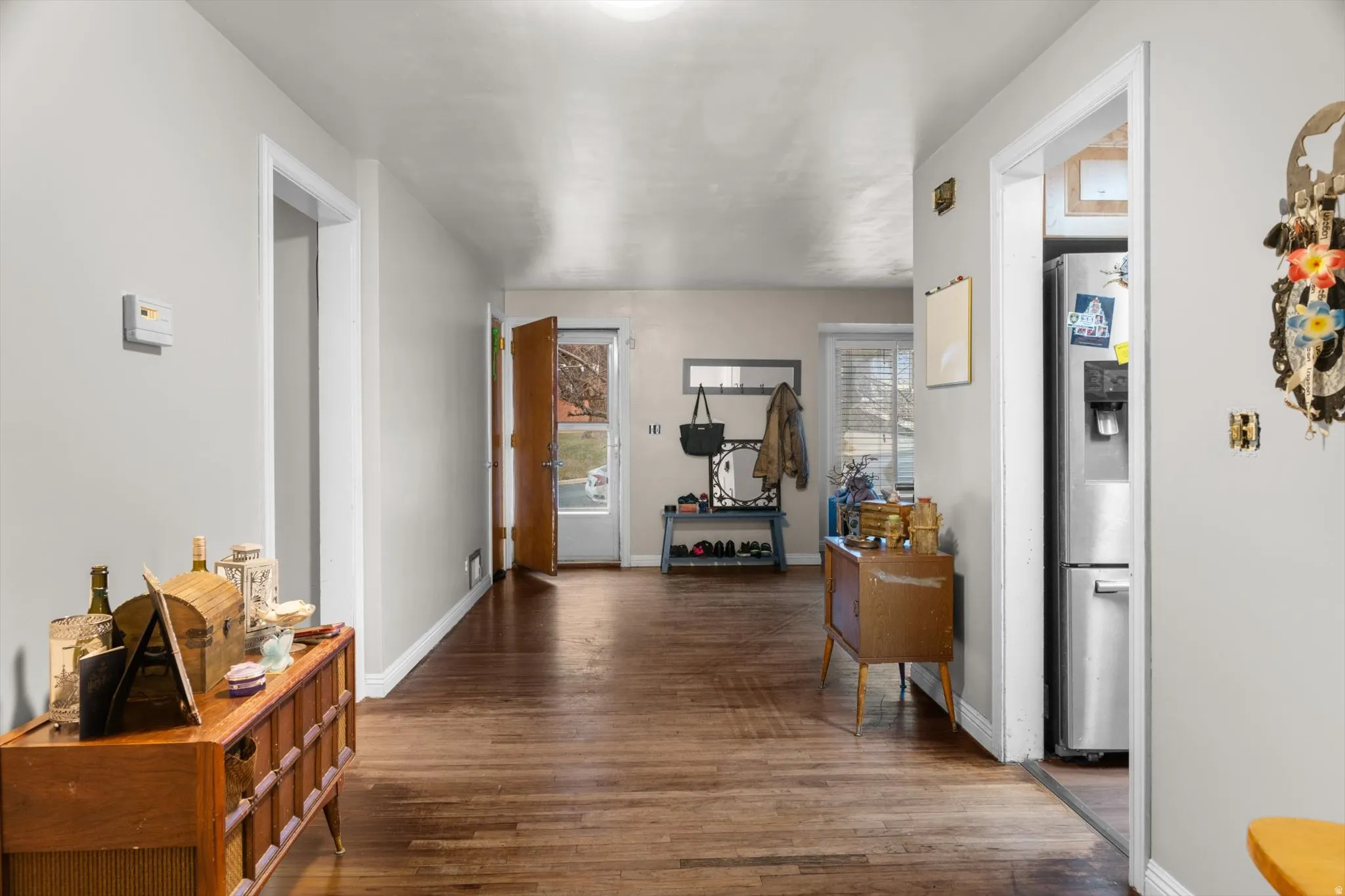 Hardwood-finish flooring extends through the main corridor