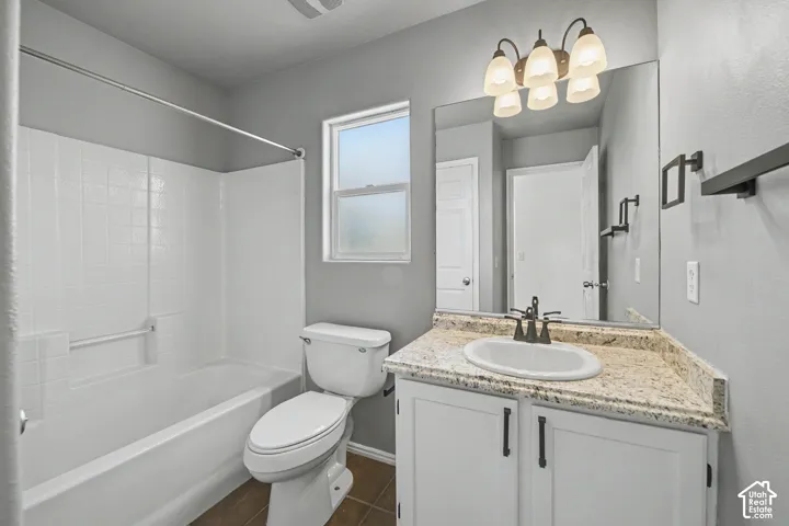 White tiled tub and shower combination