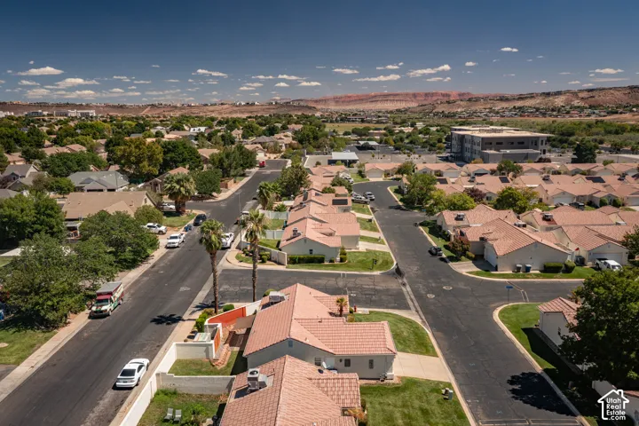 Residential neighborhood with uniform tile roofs and mature landscaping