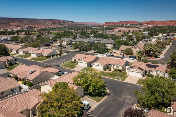 Residential neighborhood with red rock mountain backdrop