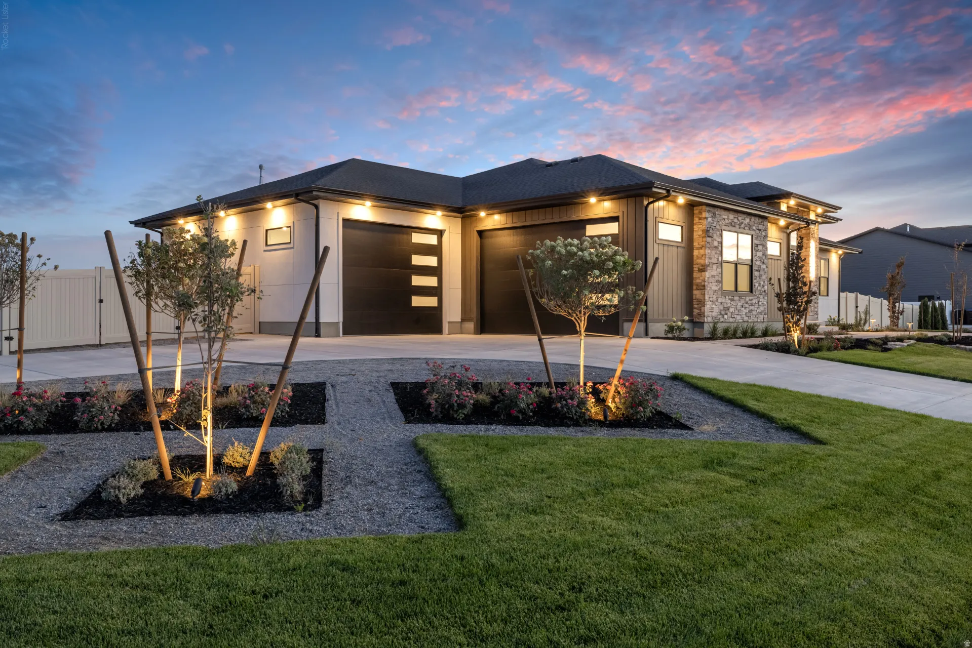 Modern single-story residence featuring a striking black hip roof, clean-lined architectural design, and expansive glass-panel entry door