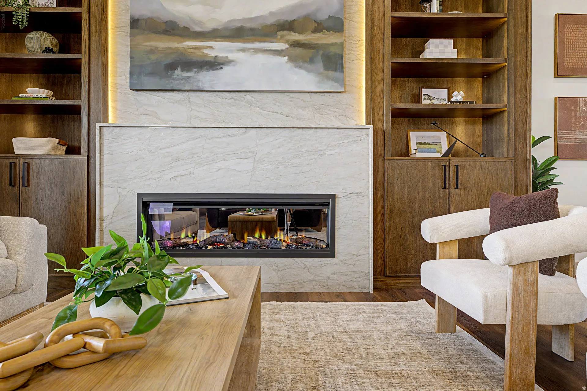 Contemporary linear fireplace set within a tiled hearth, flanked by built-in wood-finish cabinetry and shelving