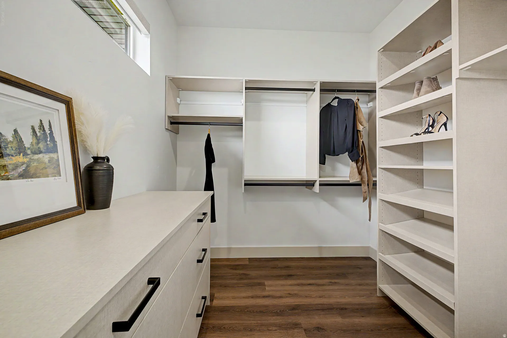 Custom closet system with wood-finish flooring