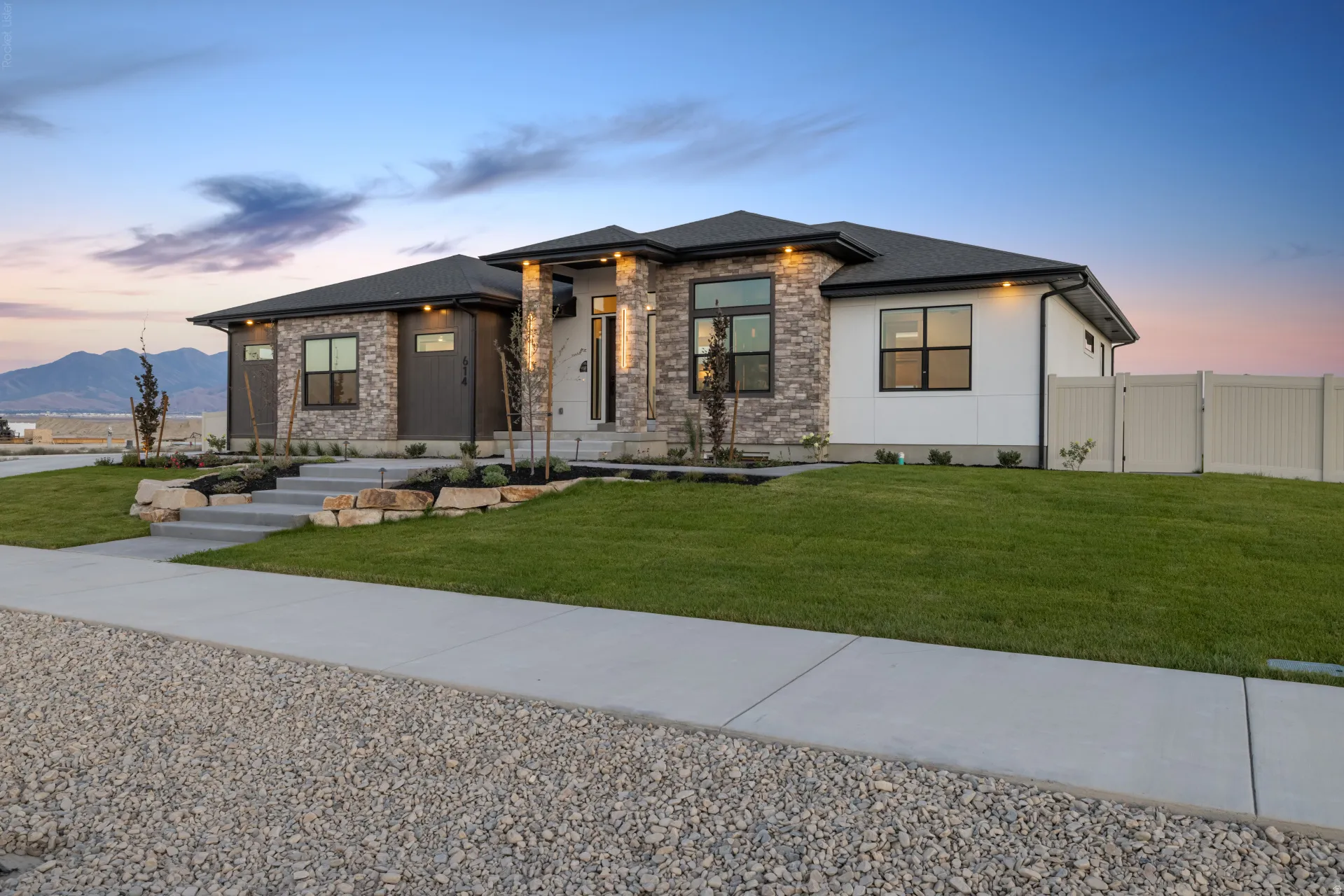 Contemporary ranch-style exterior featuring stone and stucco accents