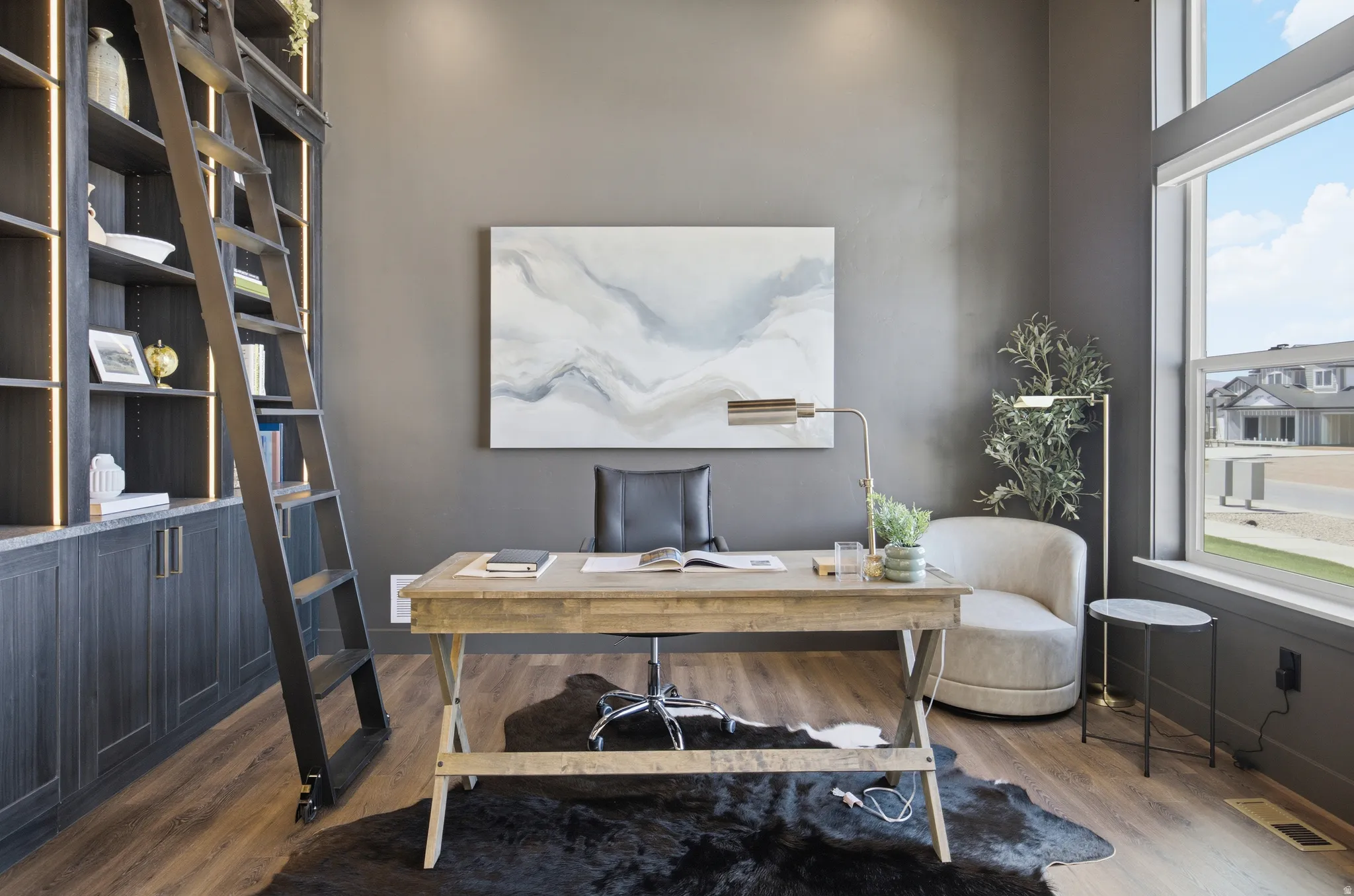 Built-in bookcase with a rolling ladder and integrated lighting
