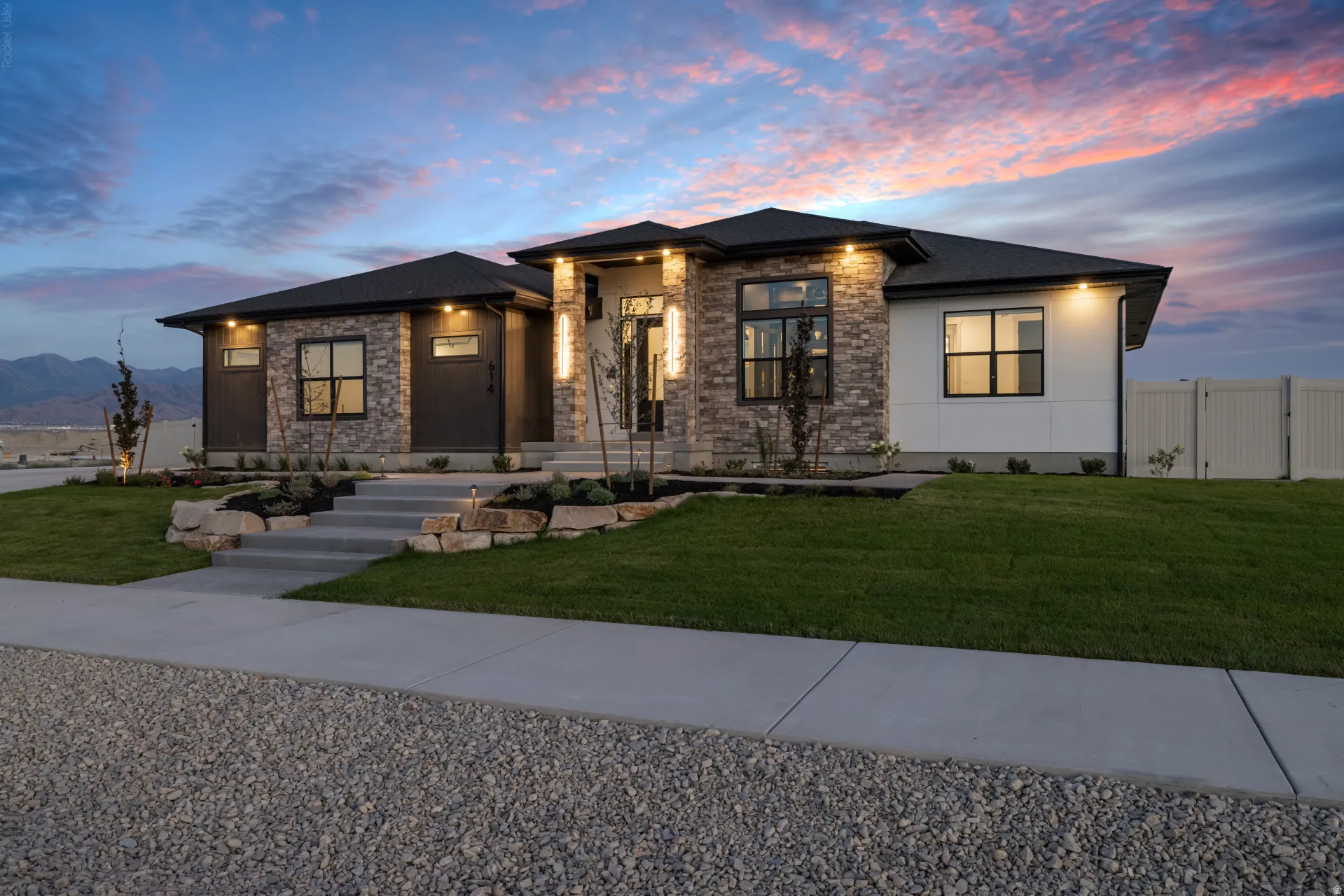 Modern ranch-style residence featuring a stone and stucco exterior