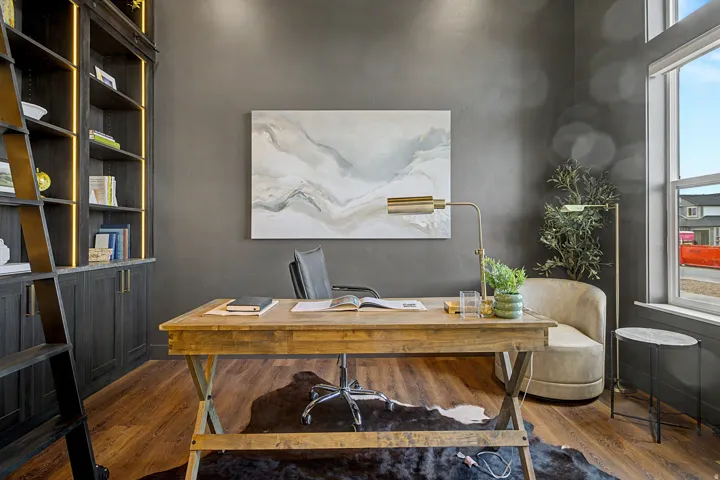 Dedicated space featuring rich wood-finish flooring and dark wall finishes