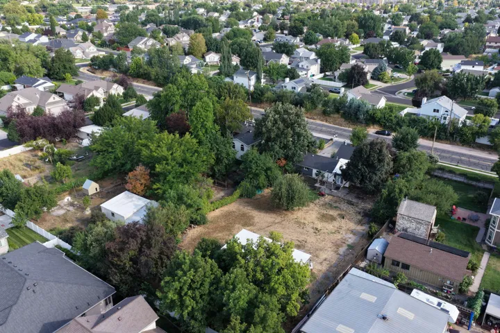 Residential neighborhood setting with mature trees and established homes