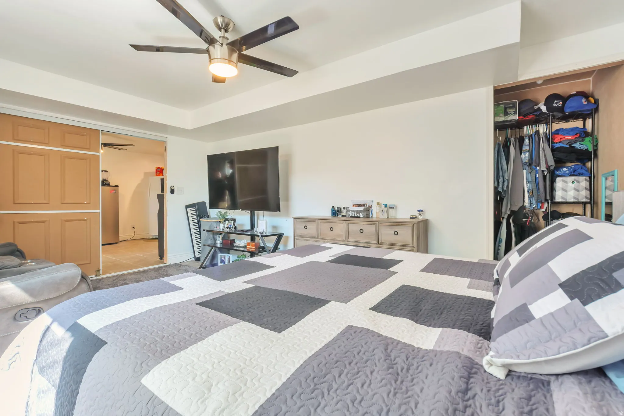 Recessed ceiling with a modern ceiling fan featuring light kit