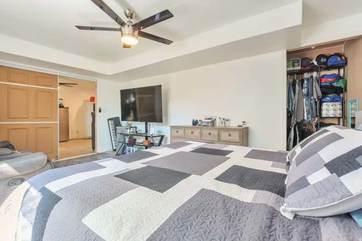 Recessed ceiling with a modern ceiling fan featuring light kit